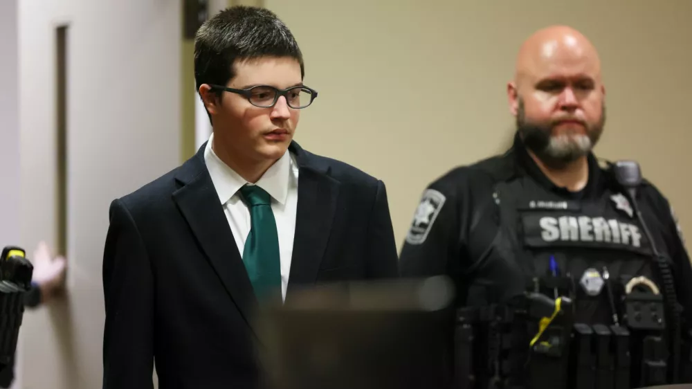 Colt Gray, the 16-year-old Apalachee High School shooting suspect, is led in by deputies for his sentencing at Barrow County Superior Court, Monday, July 27, 2026, in Winder, Ga. (Jason Getz/Atlanta Journal-Constitution via AP, Pool)
