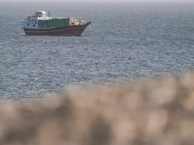FILE PHOTO: A vessel in the Strait of Hormuz, as seen from Musandam,Oman, July 16, 2026. REUTERS/Stringer/File Photo