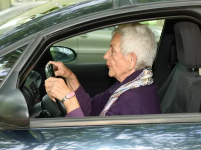 senior woman driving a car
