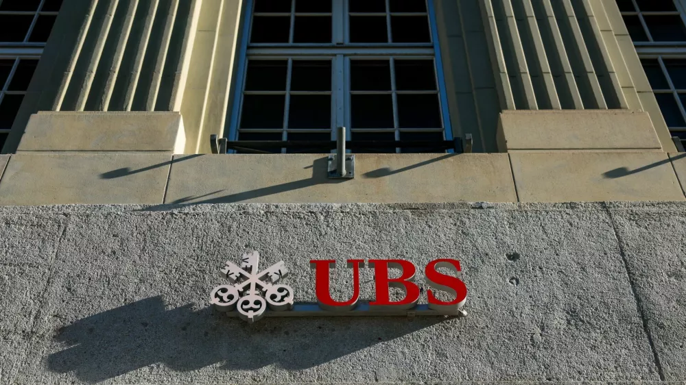 FILE PHOTO: A logo of Swiss bank UBS is seen on their branch in Bern, Switzerland, April 21, 2026. REUTERS/Denis Balibouse/File Photo