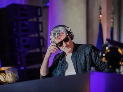 FILE - French Vincent Belorgey, known as Kavinsky, performs during the 'Fete de la Musique', the music day celebration in the courtyard of the Elysee Palace, in Paris, Thursday, 21 June 2018. (Christophe Petit Tesson, Pool via AP, FILE)