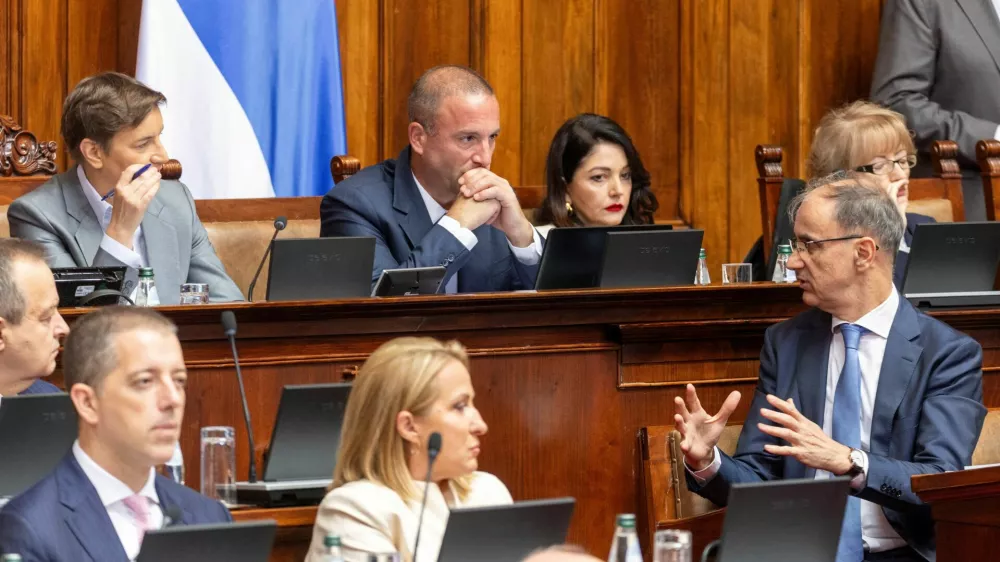 Serbia's Prime Minister Djuro Macut speaks with Ana Brnabic, President of the National Assembly of Serbia, during a parliamentary session ahead of a no-confidence vote against the government triggered by the opposition, in Belgrade, Serbia, July 27, 2026. REUTERS/Djordje Kojadinovic