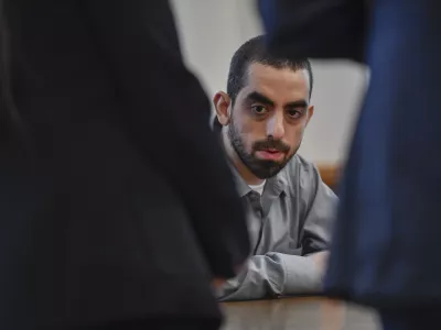 Hadi Matar, charged with severely injuring author Salman Rushdie in a 2022 knife attack, sits in Chautauqua County court after being found guilty on all counts in Mayville, N.Y., Friday, Feb. 21, 2025. (AP Photo/Adrian Kraus)