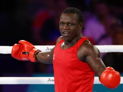 Commonwealth Games 2026 - Boxing - SEC Centre, Glasgow, Scotland, Britain - July 29, 2026 Uganda's Aziz Abdul reacts during the men's 90+kg quarter-final 2 against England's Damar Thomas REUTERS/Matthew Childs