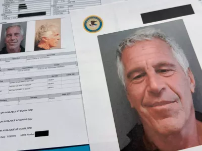 FILE - Documents that were included in the U.S. Department of Justice release of the Jeffrey Epstein files are photographed on Jan. 2, 2026. (AP Photo/Jon Elswick, File)