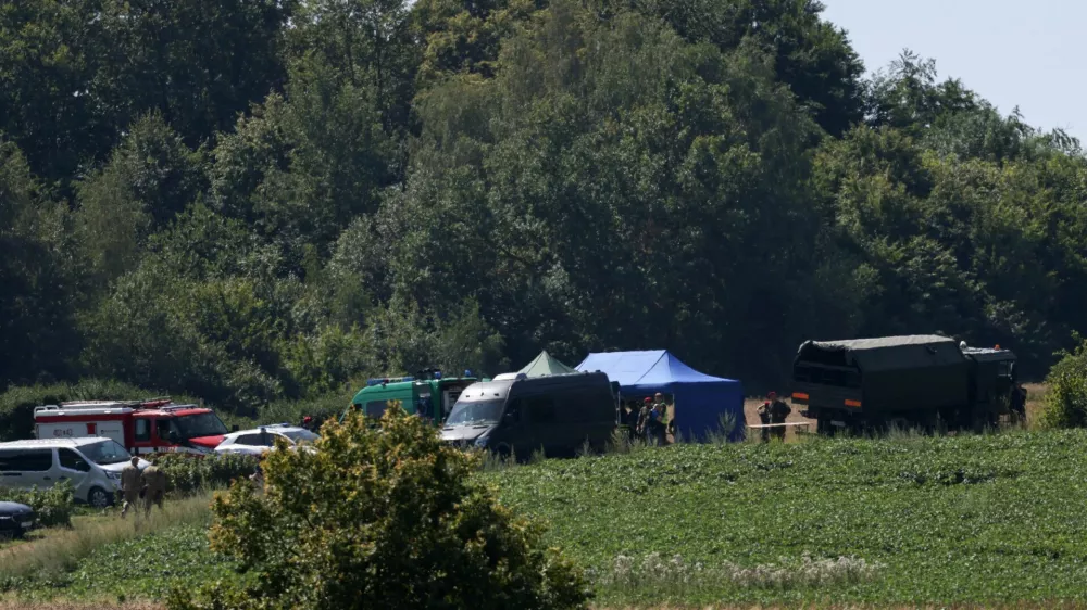 Members of the military and emergency services work near a crater left by an unidentified object that appears to be a Russian missile, Polish Prime Minister Donald Tusk said on Thursday, in a field near the village of Tarnawa-Kolonia in Lublin province, Poland, July 30, 2026. REUTERS/Kuba Stezycki