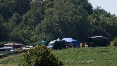Members of the military and emergency services work near a crater left by an unidentified object that appears to be a Russian missile, Polish Prime Minister Donald Tusk said on Thursday, in a field near the village of Tarnawa-Kolonia in Lublin province, Poland, July 30, 2026. REUTERS/Kuba Stezycki
