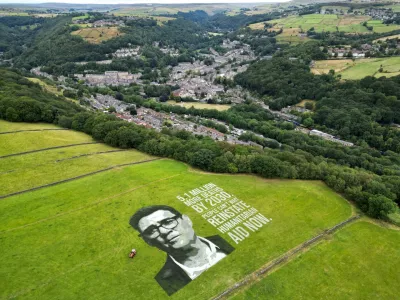 A drone view of a 4,000-square-metre land portrait depicting British Prime Minister Andy Burnham is displayed in a campaign commissioned by humanitarian organisation Concern Worldwide, near Hebden Bridge, Britain, July 30, 2026, calling for the restoration of humanitarian aid after what the organisation says was a decline in British aid spending to its lowest level in more than 25 years. REUTERS/Temilade Adelaja   TPX IMAGES OF THE DAY