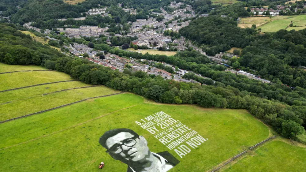 A drone view of a 4,000-square-metre land portrait depicting British Prime Minister Andy Burnham is displayed in a campaign commissioned by humanitarian organisation Concern Worldwide, near Hebden Bridge, Britain, July 30, 2026, calling for the restoration of humanitarian aid after what the organisation says was a decline in British aid spending to its lowest level in more than 25 years. REUTERS/Temilade Adelaja   TPX IMAGES OF THE DAY