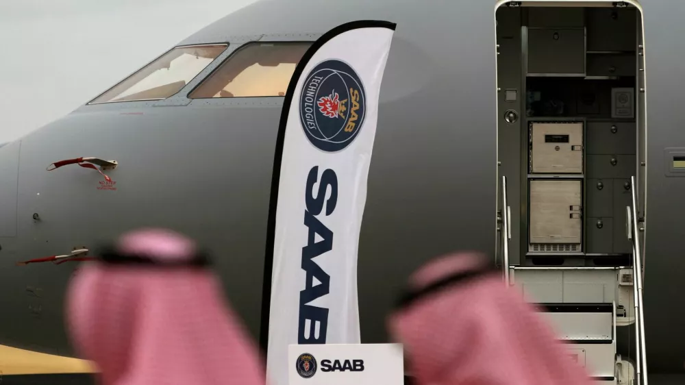 FILE PHOTO: Vistors walk past a GlobalEye aircraft, manufactured by Saab Technologies, on static display during the fifth day of Dubai Air Show in Dubai, United Arab Emirates November 21, 2019. Picture taken November 21, 2019. REUTERS/Christopher Pike/File Photo