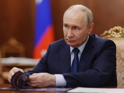 Russian President Vladimir Putin attends a meeting with Deputy Prime Minister - Presidential Envoy to the Far Eastern Federal District Yury Trutnev at the Kremlin in Moscow, Thursday, Aug. 6, 2026. (Alexander Kazakov, Sputnik, Kremlin Pool Photo via AP)