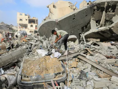 A Palestinian boy inspects the site of Wednesday's Israeli strike on a house whose residents were pre-warned by the Israeli military to evacuate, in Gaza City, July 30, 2026. REUTERS/Dawoud Abu Alkas
