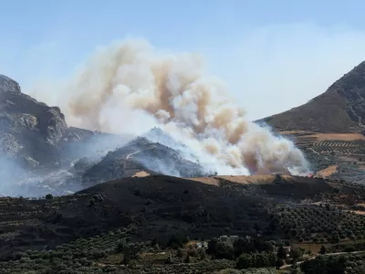 A wildfire burns in a canyon near Asomatos village on the island of Crete, Greece, July 30, 2026. REUTERS/Stringer