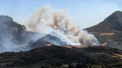 A wildfire burns in a canyon near Asomatos village on the island of Crete, Greece, July 30, 2026. REUTERS/Stringer