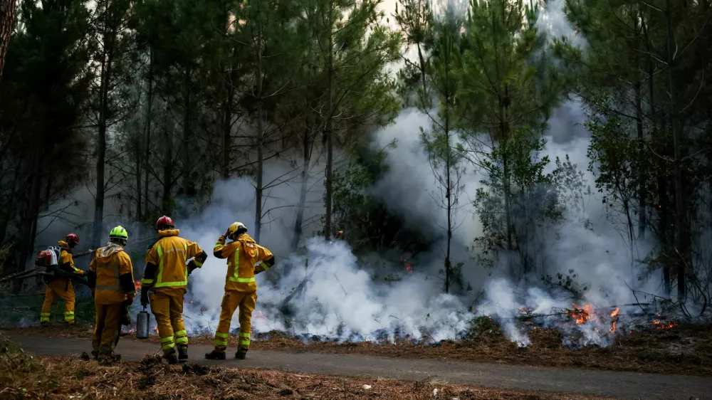 FILE PHOTO: Firefighters carry out controlled burning operations in Le Porge, Gironde department, amid drought conditions following a heatwave and water shortages across much of France, July 30, 2026. REUTERS/Sarah Meyssonnier/File Photo