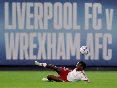 Jul 29, 2026; New York, New York, USA; Liverpool FC defender Jeremie Frimpong (30) passes the ball against Wrexham AFC during the second half at Yankee Stadium. Mandatory Credit: Brad Penner-Imagn Images