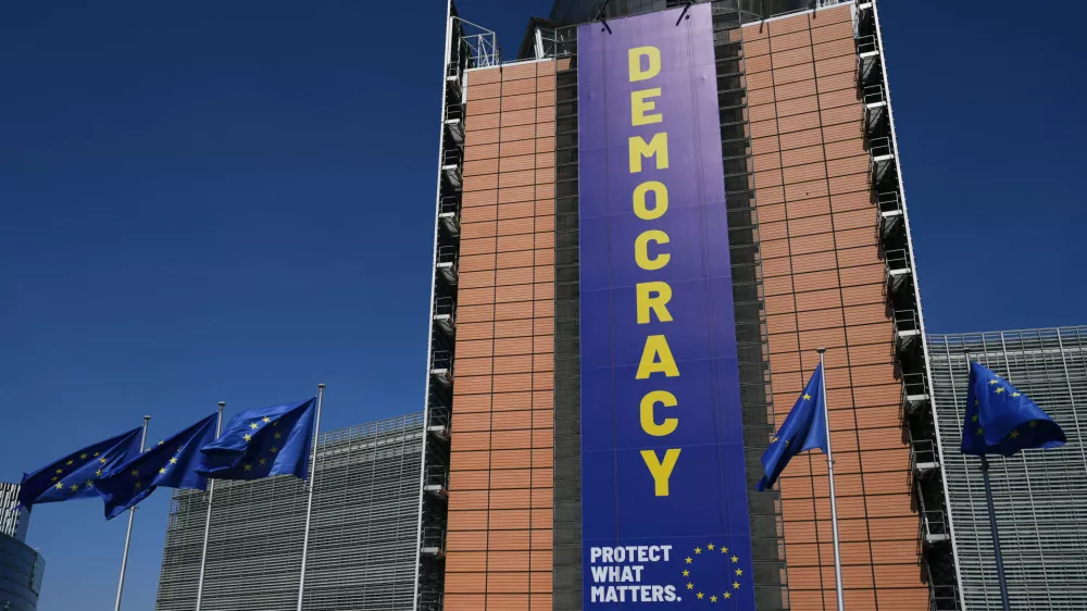 Visitors wait in line to get into an open house to celebrate Europe Day at EU headquarters in Brussels, Saturday, May 9, 2026. (AP Photo/Virginia Mayo)