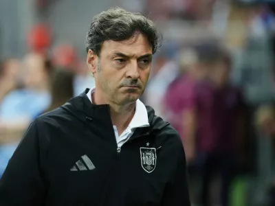 FILE - Spain's coach Santi Denia walks prior to a quarter final soccer match between Spain and England at the European U-21 Championship at the Anton Malatinsky Stadium, in Trnava, Slovakia, Saturday, June 21, 2025. (AP Photo/Petr David Josek, file)