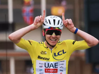 Cycling - Tour de France - Stage 20 - Le Bourg d'Oisans to Alpe d'Huez - Alpe d'Huez, France - July 25, 2026 UAE Team Emirates XRG's Tadej Pogacar wearing the yellow jersey reacts at the end of stage 20 REUTERS/Stephanie Lecocq