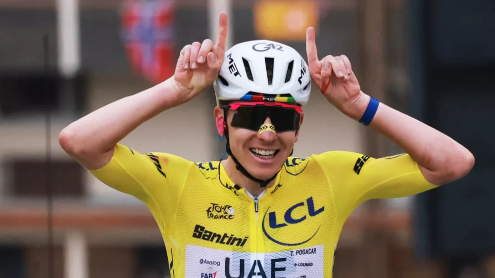 Cycling - Tour de France - Stage 20 - Le Bourg d'Oisans to Alpe d'Huez - Alpe d'Huez, France - July 25, 2026 UAE Team Emirates XRG's Tadej Pogacar wearing the yellow jersey reacts at the end of stage 20 REUTERS/Stephanie Lecocq