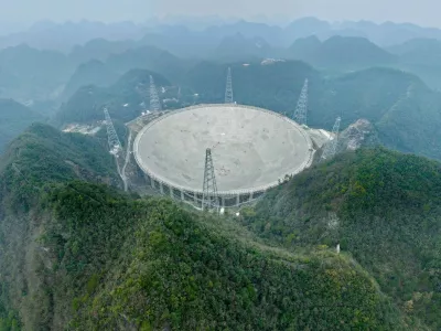 GUIYANG, Jan. 16, 2026 -- An aerial drone photo taken on Jan. 16, 2026 shows China's Five-hundred-meter Aperture Spherical Radio Telescope (FAST) under maintenance in southwest China's Guizhou Province. Through studying the observation data of China's gigantic radio telescope located in the country's southwestern Guizhou Province, an international research team has uncovered compelling new evidence supporting a binary-system origin for at least some fast radio bursts, one of the most enigmatic phenomena in modern astrophysics. These findings made by the research team, led by astronomers from the Purple Mountain Observatory of the Chinese Academy of Sciences, are based on observations using FAST, and have been published online in the journal Science.,Image: 1066473089, License: Rights-managed, Restrictions:, Model Release: no 