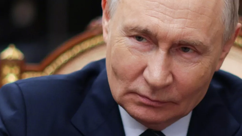 Russian President Vladimir Putin listens to Russian Railways CEO Oleg Belozerov at the Kremlin in Moscow, Friday, July 31, 2026. (Alexander Kazakov/Sputnik, Kremlin Pool Photo via AP)