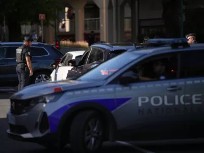 A France Police officer controls cars at a check point ahead of the G7 summit in Evian-les-Bains, France, Monday, June 15, 2026. (AP Photo/Christophe Ena)