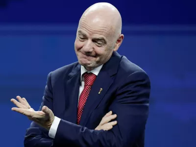 FIFA President Gianni Infantino reacts on stage during a gala celebrating Conmebol's President Alejandro Dominguez's 10th anniversary as head of the organization, in Asuncion, Paraguay, January 26, 2026. REUTERS/Cesar Olmedo