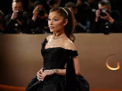 FILE PHOTO: Ariana Grande poses on the red carpet at the 83rd Annual Golden Globes in Beverly Hills, California, U.S., January 11, 2026. REUTERS/Daniel Cole/File Photo
