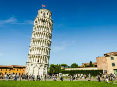 Pisa, Italy - August 17, 2014: The Leaning Tower of Pisa in the Square of Miracles (Piazza dei Miracoli).