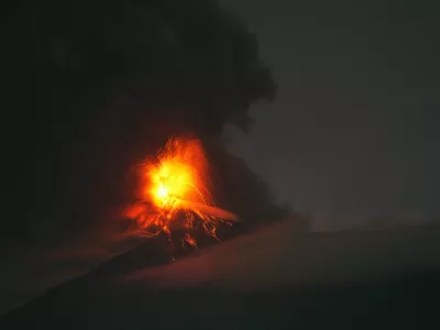 Lava flows and clouds of ash out of the crater of the Fuego Volcano, as seen from San Juan Alotenango, Guatemala, Tuesday, Aug. 4, 2026. (AP Photo/Moises Castillo)