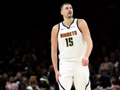 Denver Nuggets center Nikola Jokic (15) looks on during the second half of Game 6 of a first-round NBA basketball playoffs series against the Minnesota Timberwolves, Thursday, April 30, 2026, in Minneapolis. (AP Photo/Matt Krohn)