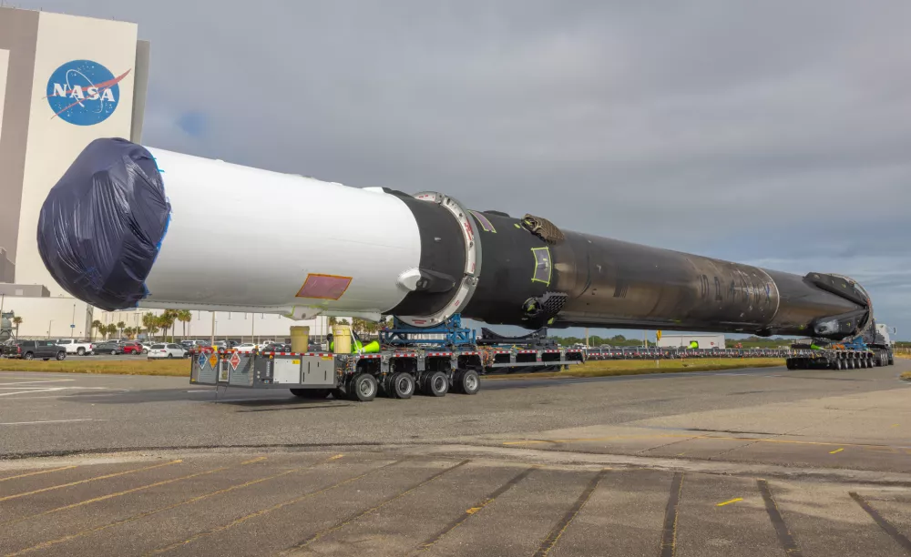 Crossing in front of the VAB SoaceX moves Falcon 9 first stage booster B-1077 to one of their launch pads for another future mission. Kennedy Sopace Center Brevard County Florida USA. (Photo by Scott Schilke/SipaUSA)