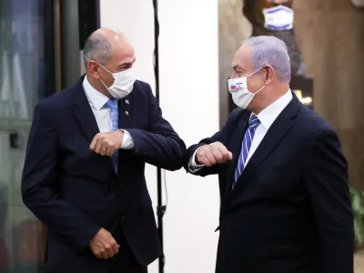 Slovenian Prime Minister Janez Jansa and Israeli Prime minister Benjamin Netanyahu wear protective masks as they meet in Jerusalem December 8, 2020. Ohad Zwigenberg/Pool via REUTERS