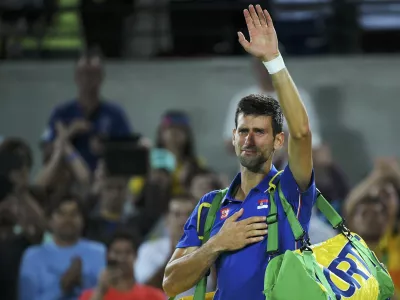 2016 Rio Olympics - Tennis - Preliminary - Men's Singles First Round - Olympic Tennis Centre - Rio de Janeiro, Brazil - 07/08/2016. Novak Djokovic (SRB) of Serbia reacts after losing his match against Juan Martin Del Potro (ARG) of Argentina. REUTERS/Toby Melville TPX IMAGES OF THE DAY. FOR EDITORIAL USE ONLY. NOT FOR SALE FOR MARKETING OR ADVERTISING CAMPAIGNS.