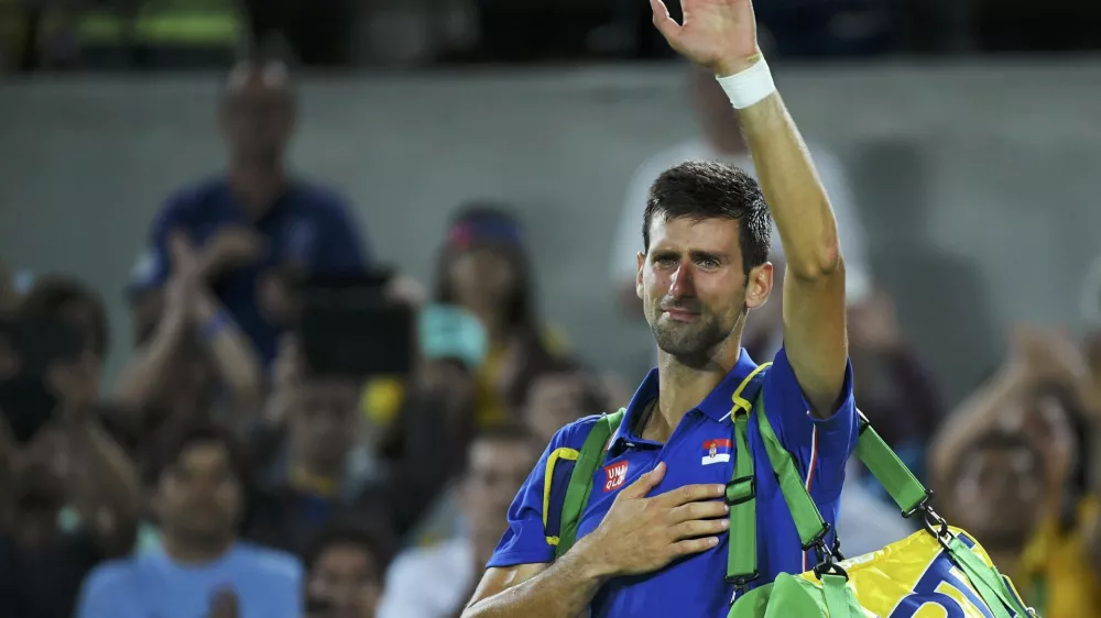 2016 Rio Olympics - Tennis - Preliminary - Men's Singles First Round - Olympic Tennis Centre - Rio de Janeiro, Brazil - 07/08/2016. Novak Djokovic (SRB) of Serbia reacts after losing his match against Juan Martin Del Potro (ARG) of Argentina. REUTERS/Toby Melville TPX IMAGES OF THE DAY. FOR EDITORIAL USE ONLY. NOT FOR SALE FOR MARKETING OR ADVERTISING CAMPAIGNS.
