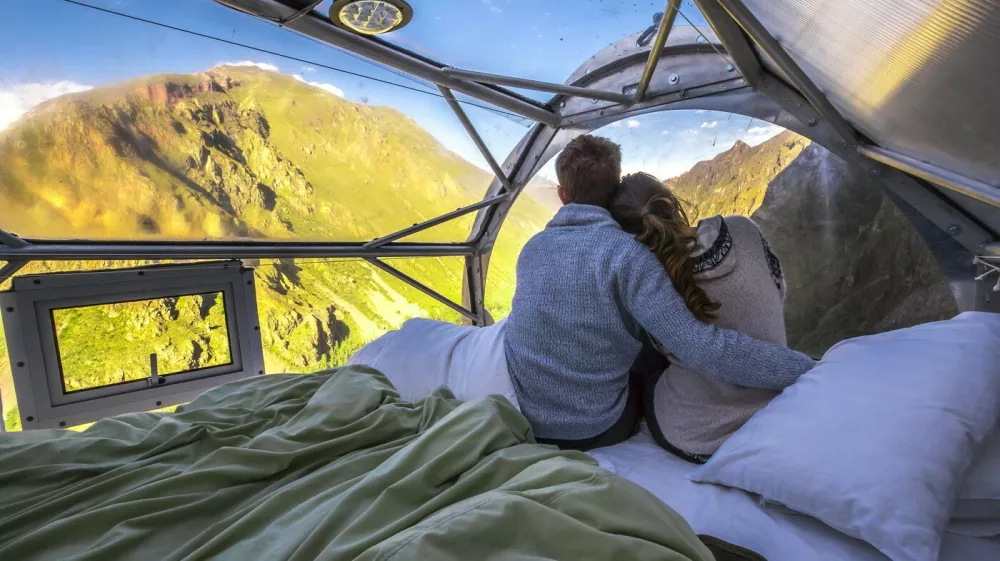 This is the worlds first hanging lodge suspended 1,200ft off the ground in Perus Sacred Valley of Cusco.Boasting stunning panoramic views, the Skylodge Adventure Suites capsules can fit up to eight people and each of the three luxurious cabins come complete with four beds, a dinning area and a private bathroom with an ecological toilet.Intrepid travelers have to climb the mountain to get to the capsule, via a secure climbing path which is fit for beginners, and are rewarded with 300 degree view of the majestic Sacred Valley once at the top.Measuring 24ft in length and 8ft in height and width, the pods are hand crafted out of aerospace aluminum and weather resistant polycarbonate.It costs around USD$450 per person for a nights stay, and the price includes a sunrise breakfast enjoyed from the comfort of your personal capsule, as well as a gourmet dinner served up with wine.At the end of the stay, guests get back down the mountain via one of seven zip lines.Skylodge Adventure Suites became the worlds first hanging lodges after launching in June 2013. It was opened by a small company called Natura Vive, a group of young entrepreneurs whose philosophy was to create a mountain experience that people of all ages and abilities can enjoy.29 Jan 2018Pictured: Skylodge Adventure Suites are comprised of three luxurious cabins which hang 1,200ft in the air on a mountainside in Perus Sacred Valley of Cusco.,Image: 361729220, License: Rights-managed, Restrictions: World Rights, Model Release: no, Pictured: Skylodge Adventure Suites are comprised of three luxurious cabins which hang 1,200ft in the air on a mountainside in Perus Sacred Valley of Cusco 