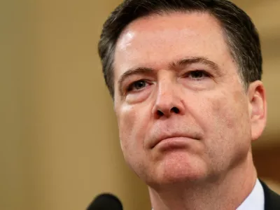 FILE PHOTO: FBI Director James Comey waits before testifying at a House Intelligence Committee hearing into alleged Russian meddling in the 2016 U.S. election, on Capitol Hill in Washington, U.S., March 20, 2017. REUTERS/Joshua Roberts/File Photo