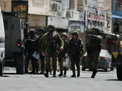 Israeli forces take part in a raid in Qalandia refugee camp, in the Israeli-occupied West Bank, August 6, 2026. REUTERS/Ammar Awad