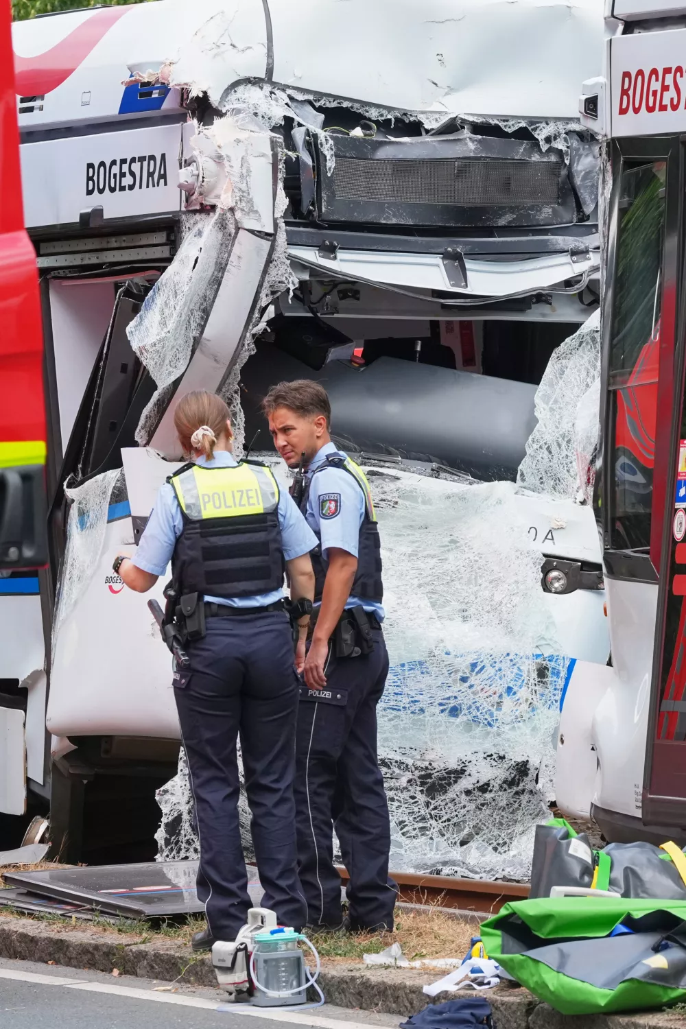Emergency responders work at the scene of an accident where two trams collided in Gelsenkirchen, Germany, Thursday, Aug. 6, 2026. (AP Photo/Martin Meissner)