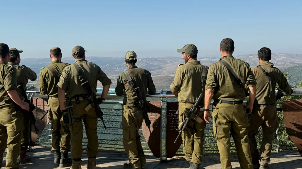 Israeli soldiers look towards Lebanon, from the Israeli side of the Israel-Lebanon border in northern Israel, August 5, 2026. REUTERS/Avi Ohayon
