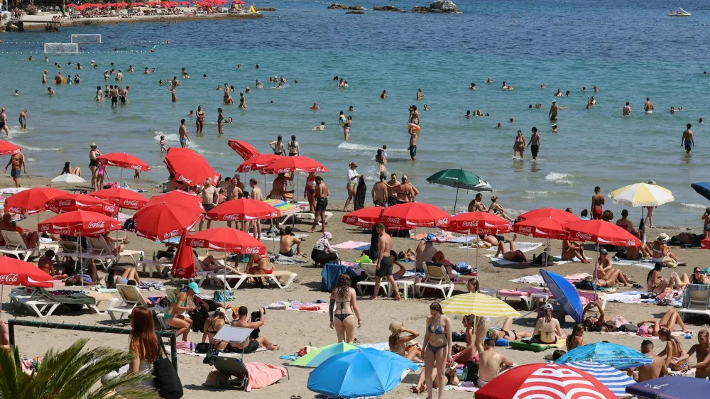 SPLIT, July 20, 2026 -- People enjoy leisure time at Bacvice Beach in Split, Croatia, on July 19, 2026.,Image: 1117480162, License: Rights-managed, Restrictions:, Model Release: no 