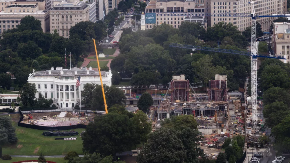 Construction continues on a helipad and the White House Ballroom on the South Lawn of the White House, Wednesday, Aug. 5, 2026, in Washington. (AP Photo/Tierney L. Cross)
