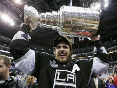 Los Angeles Kings' Anze Kopitar hoists the Stanley Cup after his team defeated the New Jersey Devils in Game 6 of the NHL Stanley Cup hockey final in Los Angeles, June 11, 2012.  REUTERS/Lucy Nicholson (UNITED STATES - Tags: SPORT ICE HOCKEY)