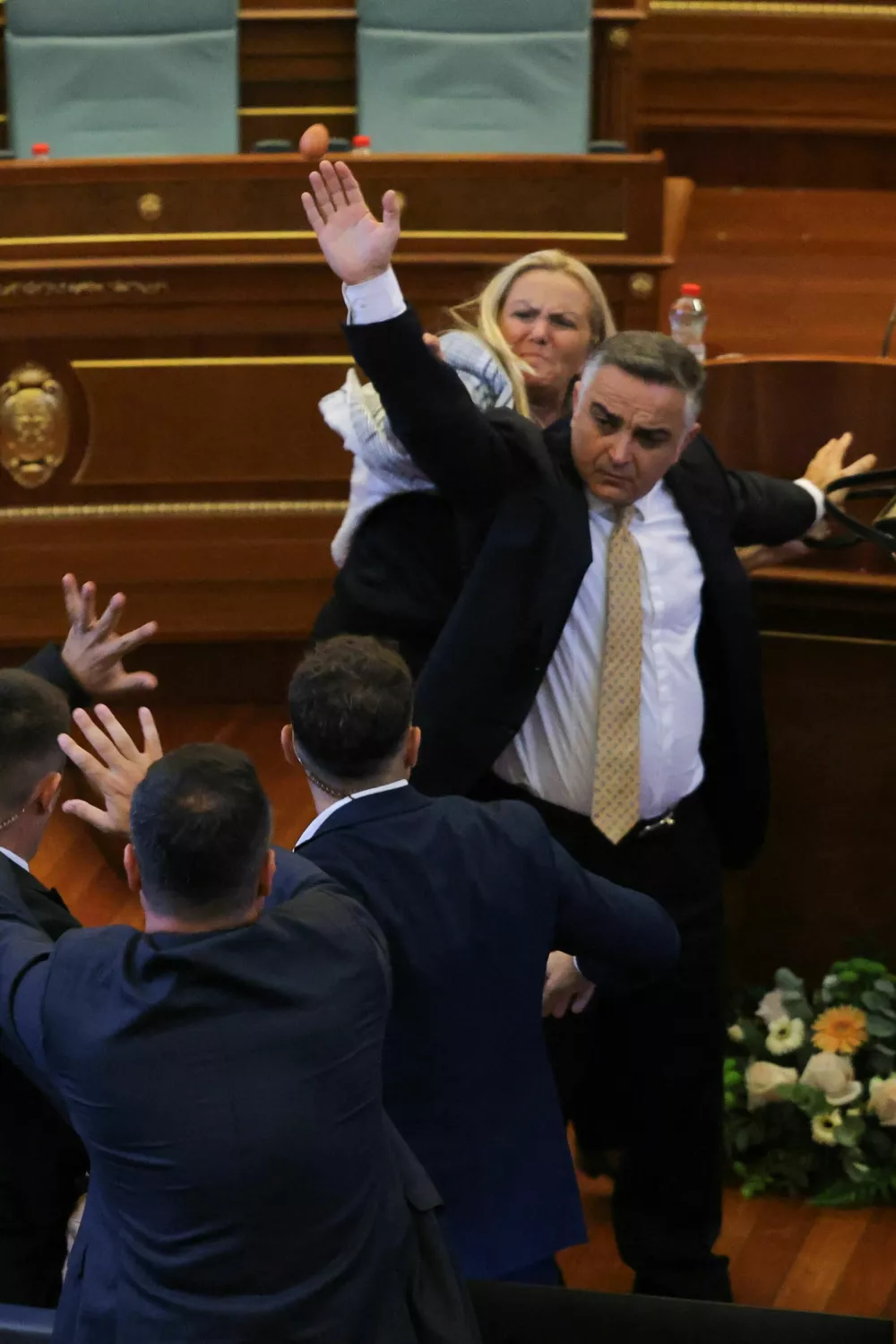 Kosovo lawmaker Time Kadriaj throws an egg at Prime Minister Albin Kurti (not pictured) during the plenary session to elect the new speaker of the parliament in Pristina, Kosovo, August 8, 2026. Kosovo parliament remains unconstituted. REUTERS/Valdrin Xhemaj