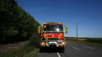A fire engine of the Ukrainian Fire Service operates near a wildfire-hit area in Le Temple, Gironde, amongst worsening drought conditions following a heatwave and water shortages across much of France, August 7, 2026. REUTERS/Nicolas Economou