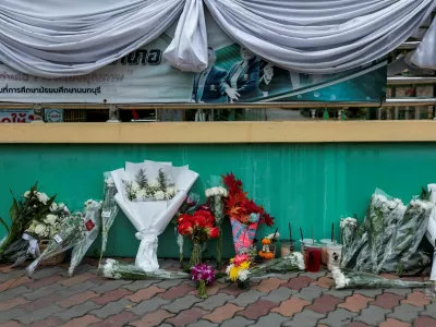 Flowers are left outside Debsirin Nonthaburi School in tribute to the victims, a day after a shooting incident at the school, in Bang Kruai district, Nonthaburi province, on the outskirts of Bangkok, Thailand, August 8, 2026. REUTERS/Chalinee Thirasupa