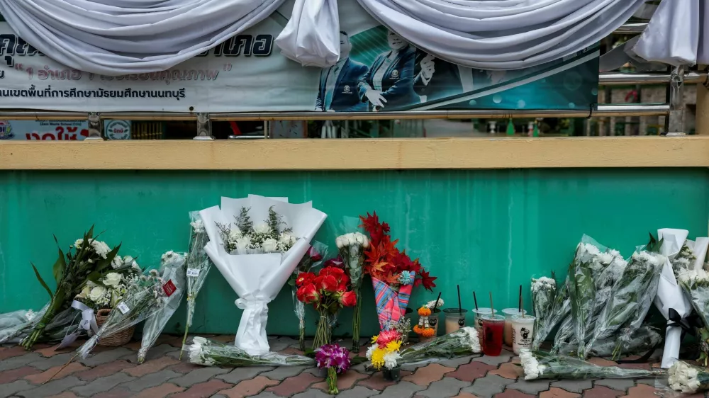 Flowers are left outside Debsirin Nonthaburi School in tribute to the victims, a day after a shooting incident at the school, in Bang Kruai district, Nonthaburi province, on the outskirts of Bangkok, Thailand, August 8, 2026. REUTERS/Chalinee Thirasupa