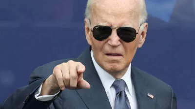 FILE PHOTO: Former U.S. President Joe Biden gestures during a dedication ceremony for the opening of the Obama Presidential Center, in Chicago, Illinois, U.S., June 18, 2026. REUTERS/Brendan McDermid/File Photo