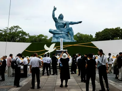 Attendees gather in front of the Nagasaki Peace Statue on the day of a ceremony commemorating the 81st anniversary of the bombing of Nagasaki at Nagasaki Peace Park in southwestern Japan, August 9, 2026. REUTERS/Manami Yamada